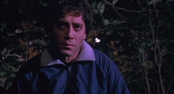 Movie still from “Before Night Falls” (2000), directed by Julian Schnabel – A person wearing a jacket; Close Up shot, Low angle