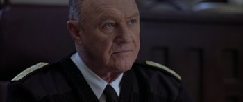 Movie still from “Behind Enemy Lines” (2001), directed by John Moore – An older man wearing a uniform looking at the camera; Close Up shot, Low angle