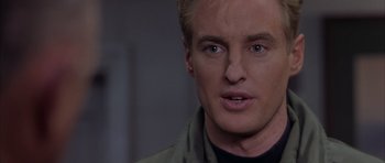 Movie still from “Behind Enemy Lines” (2001), directed by John Moore – A man's face in a dark room; Close Up shot, Over the shoulder angle