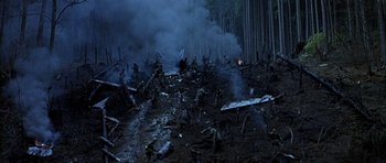 Movie still from “Behind Enemy Lines” (2001), directed by John Moore – A group of people in the middle of a forest; Extreme Wide shot, High angle