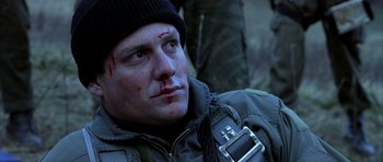 Movie still from “Behind Enemy Lines” (2001), directed by John Moore – A person with a bandage on his face; Close Up shot, Low angle