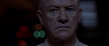 Movie still from “Behind Enemy Lines” (2001), directed by John Moore – An older man with a frown on his face; Close Up shot, Low angle