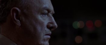 Movie still from “Behind Enemy Lines” (2001), directed by John Moore – An older man's face is lit up by the light of a flashlight; Close Up shot, Low angle