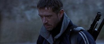 Movie still from “Behind Enemy Lines” (2001), directed by John Moore – A person wearing a jacket; Close Up shot, Low angle