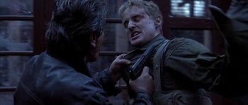 Movie still from “Behind Enemy Lines” (2001), directed by John Moore – A man holding a gun and another man holding a gun; Close Up shot, Over the shoulder angle