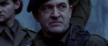 Movie still from “Behind Enemy Lines” (2001), directed by John Moore – A person wearing a uniform; Close Up shot, Low angle