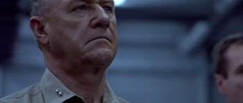 Movie still from “Behind Enemy Lines” (2001), directed by John Moore – An older man looking up into the air; Close Up shot, Low angle