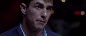 Movie still from “Behind Enemy Lines” (2001), directed by John Moore – A man's face in the dark; Close Up shot, Over the shoulder angle