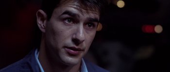Movie still from “Behind Enemy Lines” (2001), directed by John Moore – A young man's face at night; Close Up shot, Over the shoulder angle