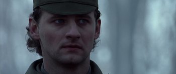 Movie still from “Behind Enemy Lines” (2001), directed by John Moore – A person wearing a hat; Close Up shot, Low angle