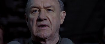 Movie still from “Behind Enemy Lines” (2001), directed by John Moore – An older man with a concerned look on his face; Close Up shot, Low angle