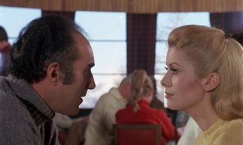 Movie still from “Belle de Jour” (1967), directed by Luis Buñuel – A man and a woman face to face in a restaurant; Close Up shot, Over the shoulder angle