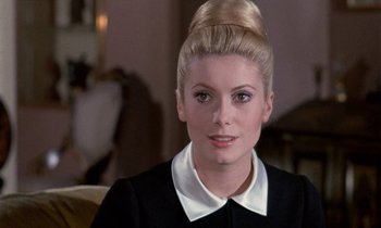 Movie still from “Belle de Jour” (1967), directed by Luis Buñuel – A person wearing a suit and tie; Close Up shot, Over the shoulder angle