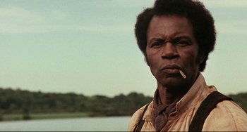 Movie still from “Beloved” (1998), directed by Jonathan Demme – A man with a cigarette in his mouth; Close Up shot, Low angle