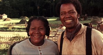 Movie still from “Beloved” (1998), directed by Jonathan Demme – An older woman standing next to an older man; Close Up shot, Low angle