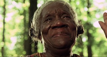 Movie still from “Beloved” (1998), directed by Jonathan Demme – An old woman with a very sad look on her face; Close Up shot, Low angle