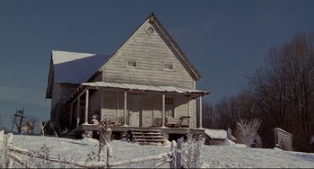 Movie still from “Beloved” (1998), directed by Jonathan Demme – An old wooden house in the middle of a snowy field; Extreme Wide shot, Low angle