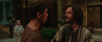 Movie still from “Ben-Hur” (2016), directed by Timur Bekmambetov – Two men are standing in front of each other talking; Close Up shot, Over the shoulder angle