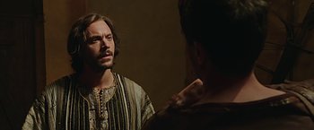Movie still from “Ben-Hur” (2016), directed by Timur Bekmambetov – A man is looking at himself in the mirror; Close Up shot, Over the shoulder angle