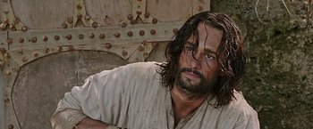 Movie still from “Ben-Hur” (2016), directed by Timur Bekmambetov – A person with long hair and a beard; Close Up shot, High angle