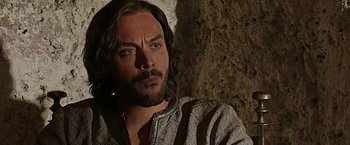 Movie still from “Ben-Hur” (2016), directed by Timur Bekmambetov – A person with long brown hair and a beard; Close Up shot, Low angle
