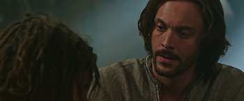 Movie still from “Ben-Hur” (2016), directed by Timur Bekmambetov – A person with long hair and a beard; Close Up shot, Over the shoulder angle