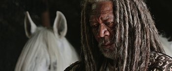 Movie still from “Ben-Hur” (2016), directed by Timur Bekmambetov – An older man with dreads is looking at the camera; Close Up shot, Low angle