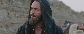 Movie still from “Ben-Hur” (2016), directed by Timur Bekmambetov – A man with long hair and a beard wearing a black robe; Close Up shot, Low angle