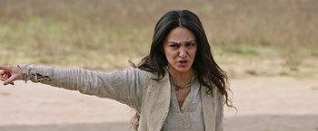 Movie still from “Ben-Hur” (2016), directed by Timur Bekmambetov – A woman with long black hair is standing in the dirt; Close Up shot, Low angle