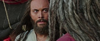 Movie still from “Ben-Hur” (2016), directed by Timur Bekmambetov – A man with a long beard looking at another man with dreadlocks; Close Up shot, Over the shoulder angle