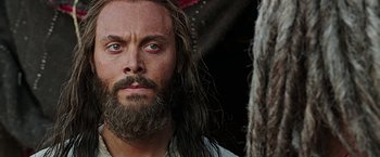 Movie still from “Ben-Hur” (2016), directed by Timur Bekmambetov – A person with long hair and a beard; Close Up shot, Low angle