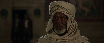 Movie still from “Ben-Hur” (2016), directed by Timur Bekmambetov – An older man wearing a turban and a head covering; Close Up shot, High angle