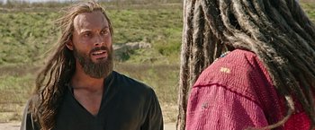 Movie still from “Ben-Hur” (2016), directed by Timur Bekmambetov – A man with a long beard talking to a woman with dreads; Close Up shot, Over the shoulder angle