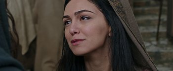 Movie still from “Ben-Hur” (2016), directed by Timur Bekmambetov – A woman's face with long black hair; Close Up shot, Over the shoulder angle