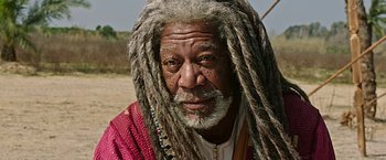 Movie still from “Ben-Hur” (2016), directed by Timur Bekmambetov – An older man with dreads is posing for a picture; Close Up shot, Low angle
