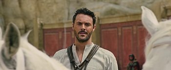 Movie still from “Ben-Hur” (2016), directed by Timur Bekmambetov – A person with a beard; Close Up shot, Over the shoulder angle