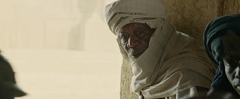 Movie still from “Ben-Hur” (2016), directed by Timur Bekmambetov – An old man wearing a head scarf and a turban; Close Up shot, Low angle