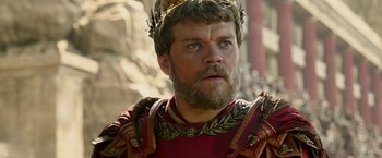 Movie still from “Ben-Hur” (2016), directed by Timur Bekmambetov – A person with a beard; Close Up shot, Over the shoulder angle