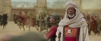 Movie still from “Ben-Hur” (2016), directed by Timur Bekmambetov – An old man with a beard and a white turban; Medium shot, Over the shoulder angle