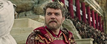 Movie still from “Ben-Hur” (2016), directed by Timur Bekmambetov – A man with a beard wearing a crown; Close Up shot, Low angle