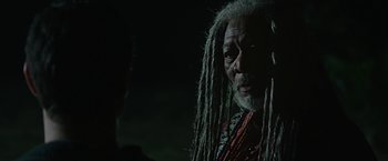 Movie still from “Ben-Hur” (2016), directed by Timur Bekmambetov – An older man with dreadlocks and a beard; Close Up shot, Over the shoulder angle