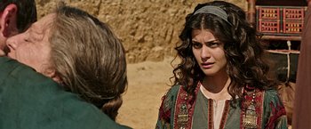 Movie still from “Ben-Hur” (2016), directed by Timur Bekmambetov – A young woman in an oriental dress talking to another woman; Close Up shot, Over the shoulder angle