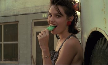 Movie still from “Betty Blue” (1986), directed by Jean-Jacques Beineix – A woman is brushing her teeth with a green toothbrush; Close Up shot, Over the shoulder angle