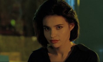 Movie still from “Betty Blue” (1986), directed by Jean-Jacques Beineix – A person with short hair; Close Up shot, Over the shoulder angle