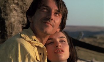 Movie still from “Betty Blue” (1986), directed by Jean-Jacques Beineix – A man and a woman posing for a picture; Close Up shot, Low angle