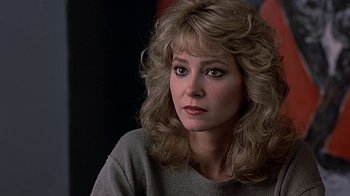 Movie still from “Beverly Hills Cop” (1984), directed by Martin Brest – A person with long hair; Close Up shot, Over the shoulder angle