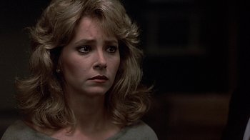 Movie still from “Beverly Hills Cop” (1984), directed by Martin Brest – A person with long blonde hair; Close Up shot, Over the shoulder angle