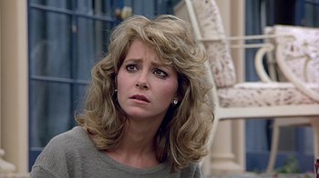 Movie still from “Beverly Hills Cop” (1984), directed by Martin Brest – A person with long hair; Close Up shot, Low angle