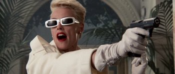 Movie still from “Beverly Hills Cop II” (1987), directed by Tony Scott – A woman wearing sunglasses and a white outfit; Close Up shot, Low angle