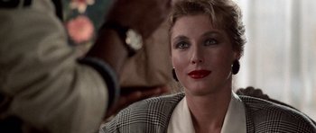 Movie still from “Beverly Hills Cop II” (1987), directed by Tony Scott – A person wearing a jacket; Close Up shot, Over the shoulder angle